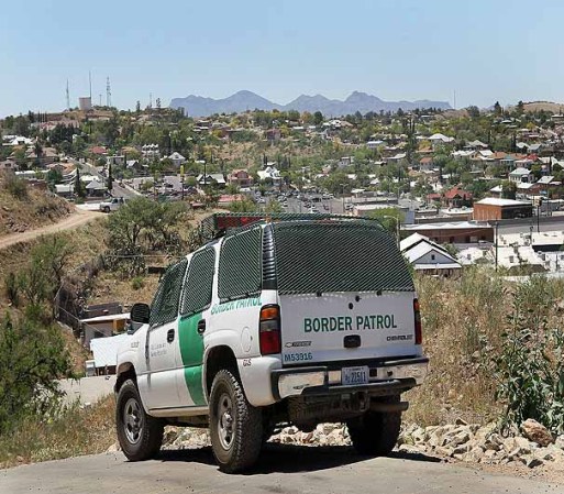 NOGALES, AZ - JUNE 01: A Border Patrol agent patrols the border June 1, 2010 in Nogales, Arizona. During the 2009 fiscal year 540,865 undocumented immigrants were apprehended entering the United States illegally along the Mexican border, 241,000 of those were captured along this 262 mile stretch of the border known as the Tucson Sector. (Photo by Scott Olson/Getty Images)