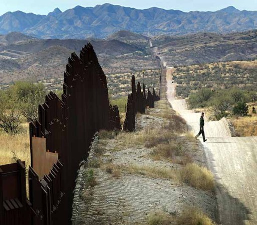 NOGALES, AZ - DECEMBER 07: U.S. Border Patrol agent Richard Funke looks for footprints from illegal immigrants crossing the U.S.- Mexico border on December 7, 2010 near Nogales, Arizona. Although a new fence has been built along the majority of Arizona's border with Mexico, critics have called for fencing of the entire stretch. Much of the unfenced terrain is in remote and mountainous areas. Although illegal immigration has slowed all along the U.S. Mexico border, Border Patrol officials say the Tucson sector remains the most heavily trafficked in the nation. (Photo by John Moore/Getty Images) *** Local Caption *** Richard Funke
