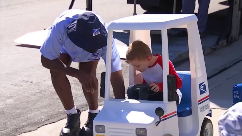 Jacob Hayward, who’s battling cancer, is the honorary mailman for Laguna on Monday, Jan. 24, 2022.