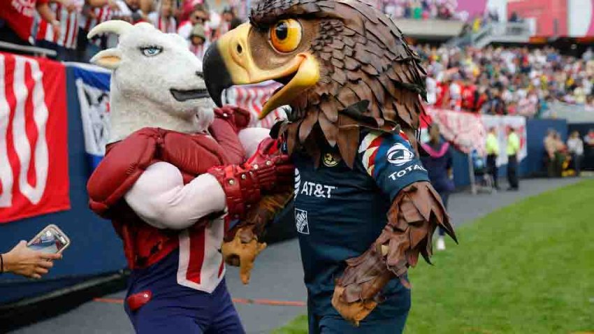 CHICAGO, ILLINOIS – SEPTEMBER 08: Mascots for Chivas de Guadalajara and Club America cross each other prior to the Super Clasico game at Soldier Field on September 08, 2019 in Chicago, Illinois. (Photo by Nuccio DiNuzzo/Getty Images)