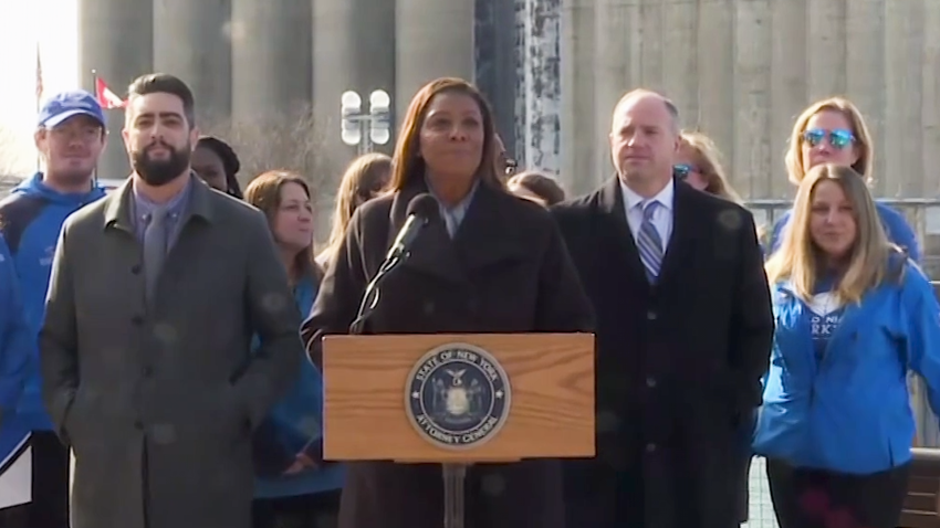 New York attorney general Letitia James stands at lectern outside while announcing lawsuit against PepsiCo