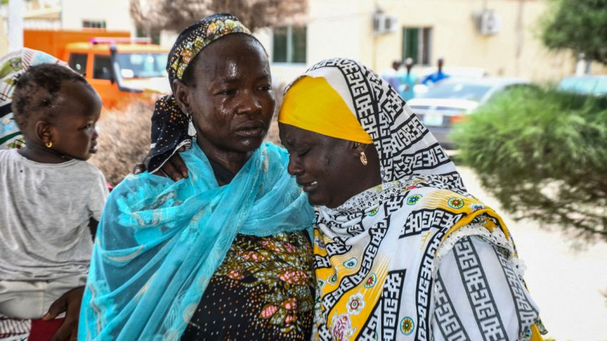 Relatives consoles each other as relatives arrive for treatment after a wave of suicide attacks in the North East of Nigeria, in Maiduguri on June 29, 2024. At least 18 people were killed and 19 seriously wounded in suicide attacks targeting a wedding, a hospital and a funeral in northeastern Nigeria on June 29, authorities said. The region has been scarred by more than a decade of violence by jihadist group Boko Haram, which did not immediately claim responsibility for the string of attacks. (Photo by Audu MARTE / AFP) (Photo by AUDU MARTE/AFP via Getty Images)