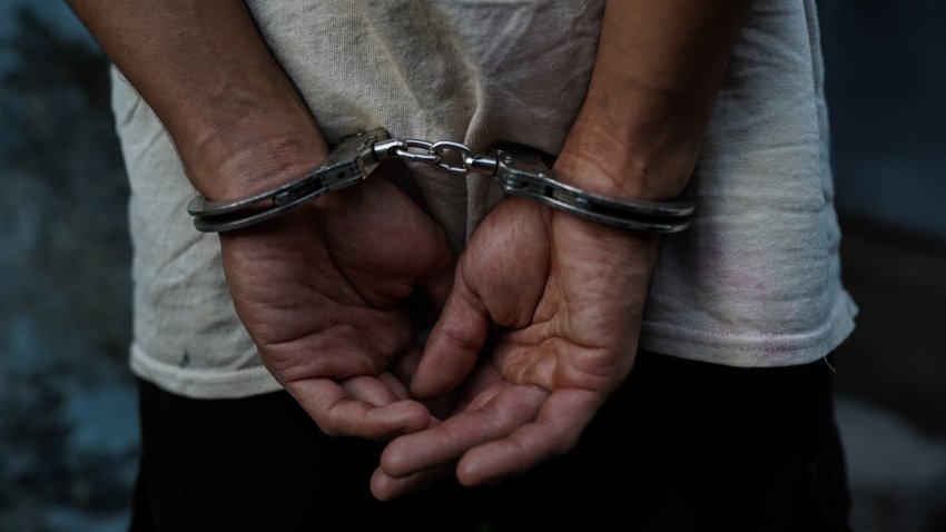 SAN SALVADOR, EL SALVADOR – 2024/02/03: A man sits handcuffed after being arrested in San Salvador. On Sunday, El Salvador will head to the polls as Salvadoran President Nayib Bukele attempts to reelect despite constitutional prohibitions. (Photo by Camilo Freedman/SOPA Images/LightRocket via Getty Images)