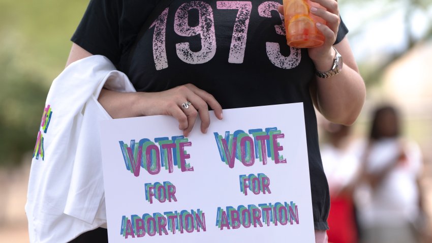 PHOENIX, AZ – JUNE. 8: A person holds a pro-abortion sign while wearing a shirt reading 1973, a reference to the year of the Roe v. Wade ruling, during Vote for Abortion’s Arizona Freedom Festival at the Arizona State Capitol on Saturday, June 8, 2024 in Phoenix, Arizona. (Photo by Rebecca Noble for The Washington Post via Getty Images)