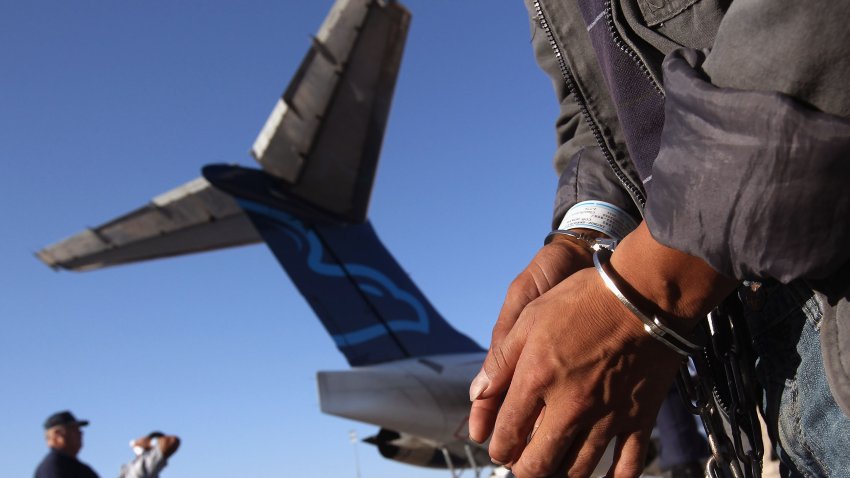 MESA, AZ – JUNE 24:  An undocumented Guatemalan immigrant, chained for being charged as a criminal, prepares to board a deportation flight to Guatemala City, Guatemala at Phoenix-Mesa Gateway Airport on June 24, 2011 in Mesa, Arizona. The U.S. Immigration and Customs Enforcement agency, ICE, repatriates thousands of undocumented Guatemalans monthly, many of whom are caught in the controversial “Secure Communities” data-sharing program which puts local police on the frontlines of national immigration enforcement. ICE recently announced a set of adjustments to the federal program after many local communities and some states, including New York, insisted on opting out, saying immigrants were being deported for minor offenses such as traffic violations. Guatemala ranks only second to Mexico in the number of illegal immigrants deported from the United States.  (Photo by John Moore/Getty Images)