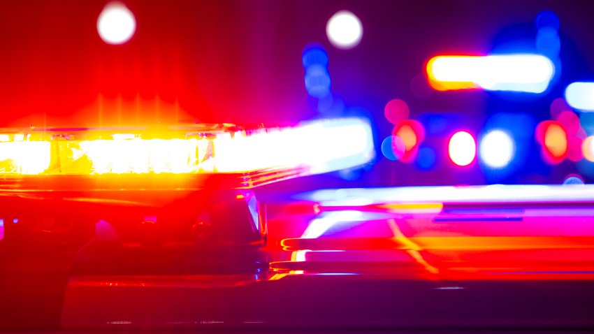 Red and blue flashing police lights at a crime scene.