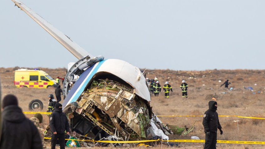 Emergency specialists work at the crash site of an Azerbaijan Airlines passenger jet near the western Kazakh city of Aktau on December 25, 2024. (Photo by Issa Tazhenbayev / AFP) (Photo by ISSA TAZHENBAYEV/AFP via Getty Images)