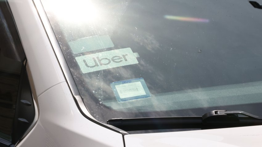 NEW YORK, NEW YORK – JUNE 26: An Uber logo is seen on a car as drivers participate in a caravan protest at the Uber offices in the Falchi Building on June 26, 2024 in New York City. Uber drivers with the Independent Drivers Guild were joined by members of Justice for App Workers coalition as they staged a caravan protest and press conference to call on Uber to stop the lockouts of their apps for drivers that prevent them from working.  (Photo by Michael M. Santiago/Getty Images)