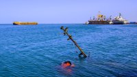 A sunken vessel is pictured at a site hit by Israeli forces in the Huthi-controlled port of Hodeida on the Red Sea on December 21, 2024. Israel has struck multiple targets in Huthi-held areas of Yemen, including ports and energy facilities, in response to a missile fired from Yemen by the Huthis on Tel Aviv before dawn, wounding 16 people in the second such attack in days. (Photo by AFP) (Photo by -/AFP via Getty Images)