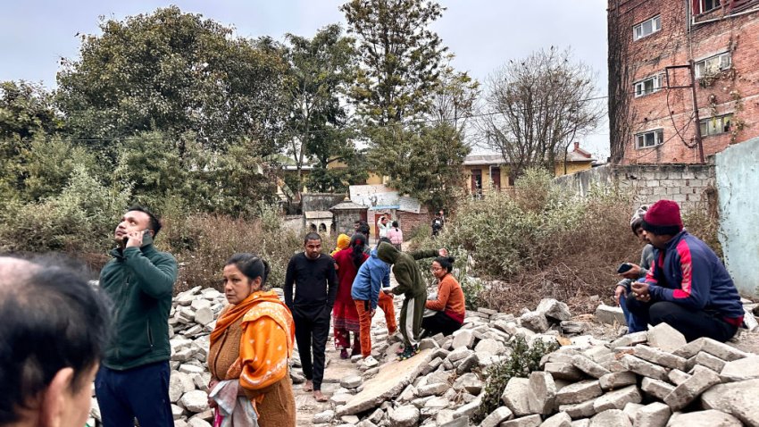 People gather in an open area following earthquake tremors in Kathmandu, in the early hours on January 7, 2025. A powerful earthquake in China’s remote Tibet region killed at least 32 people and collapsed “many buildings” on January 7, Chinese media reported, with tremors also felt in neighbouring Nepal’s capital Kathmandu and parts of India. (Photo by SUNIL SHARMA / AFP) (Photo by SUNIL SHARMA/AFP via Getty Images)