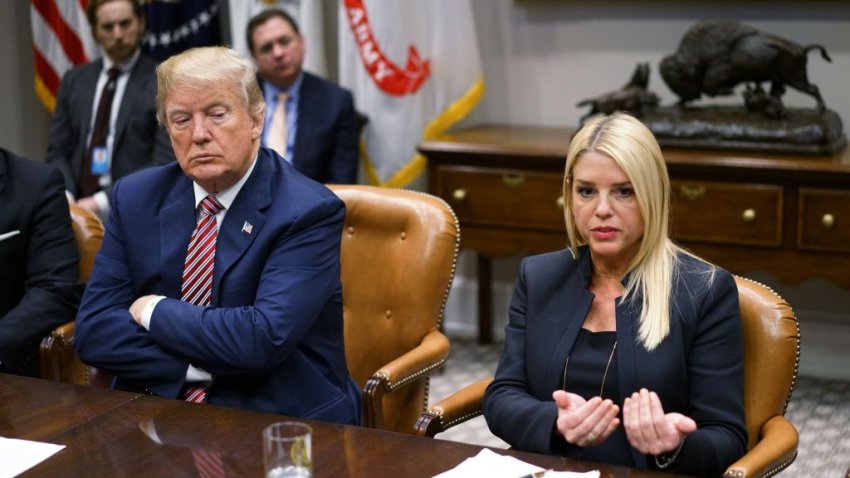 US President Donald Trump (L) watches as Florida Attorney General Pam Bondi speaks during a meeting with state and local officials on school safety in the Roosevelt Room of the White House on February 22, 2018 in Washington, DC. / AFP PHOTO / MANDEL NGAN        (Photo credit should read MANDEL NGAN/AFP via Getty Images)