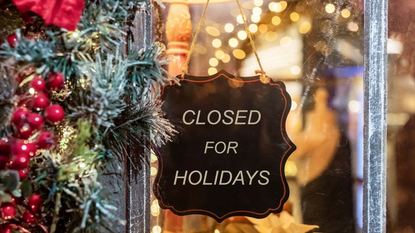 Closed for Christmas holidays, New Year vacations. text on signboard, board on window of cafe, shop, store in winter. High quality photo