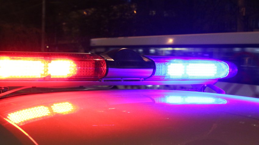 A close-up photo of police lights by night