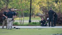Law enforcement investigates at the scene of a shooting