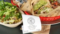 MIAMI, USA – AUGUST 22, 2018: Chipotle plate and receipt. Chipotle restaurant logo. Chipotle Mexican Grill is an American chain of fast casual restaurants