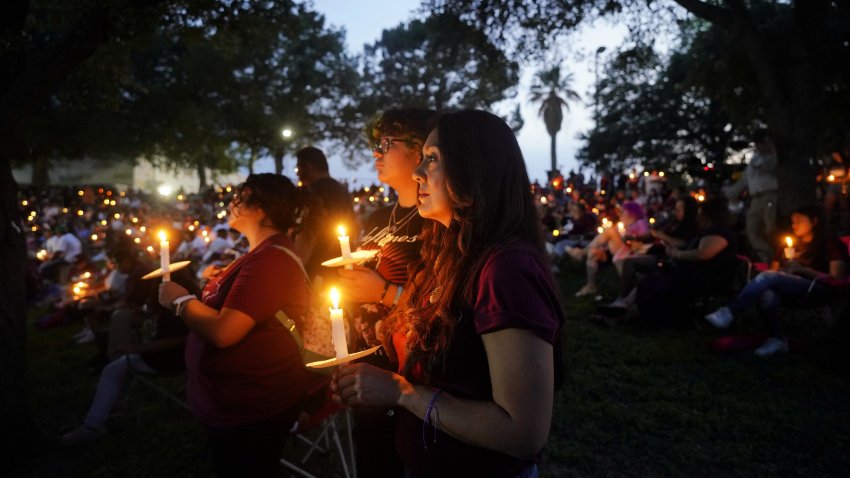 People attend a candlelight vigil for victims of a school mass shooting in Uvalde, Texas, the United States on May 24, 2023. The one-year anniversary of the school shooting killing 19 pupils and two teachers in Uvalde in the U.S. state of Texas arrives on Wednesday, marked by deep frustration as gun violence appears more rampant across the country. (Photo by Wu Xiaoling/Xinhua via Getty Images)