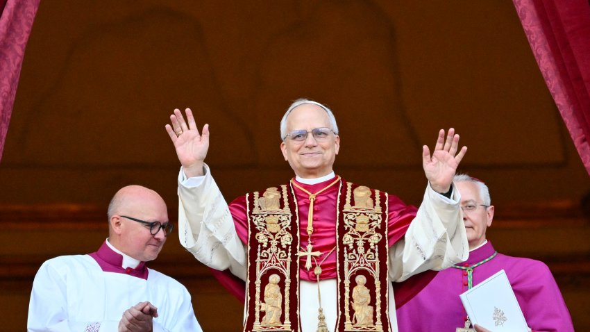TOPSHOT – Newly elected Pope Leo XIV, Robert Francis Prevost arrives on the main central loggia balcony of the St Peter’s Basilica for the first time, after the cardinals ended the conclave, in The Vatican, on May 8, 2025. Robert Francis Prevost was on Thursday elected the first pope from the United States, the Vatican announced. A moderate who was close to Pope Francis and spent years as a missionary in Peru, he becomes the Catholic Church’s 267th pontiff, taking the papal name Leo XIV. (Photo by Alberto PIZZOLI / AFP) (Photo by ALBERTO PIZZOLI/AFP via Getty Images)
