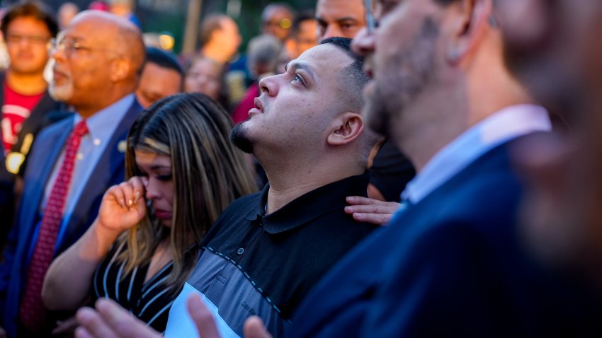 BALTIMORE, MARYLAND &#8211; AUGUST 25: Kilmar Abrego Garcia (C), accompanied by his wife Jennifer Vasquez Sura (L), looks up after a prayer vigil before he enters a U.S. Immigration and Customs Enforcement (ICE) field office on August 25, 2025 in Baltimore, Maryland. The U.S. Government is threatening to deport Garcia, a Maryland construction worker from El Salvador, to Uganda after he rejected a plea deal to be charged with Human Smuggling and deported to Costa Rica. Earlier this year Garcia was wrongfully deported to a notorious anti-terrorism prison CECOT in El Salvador. (Photo by Andrew Harnik/Getty Images)