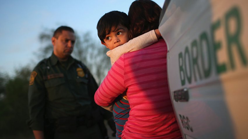 RIO GRANDE CITY, TX &#8211; DECEMBER 07:  A one-year-old from El Salvador clings to his mother after she turned themselves in to Border Patrol agents on December 7, 2015 near Rio Grande City, Texas. They had just illegally crossed the U.S.-Mexico border into Texas. The mother said she brought her son on the 24-day journey from El Salvador to escape violence in the Central American country. The number of migrant families and unaccompanied minors has again surged in recent months, even as the total number of illegal crossings nationwide has gone down over the previous year.  (Photo by John Moore/Getty Images)